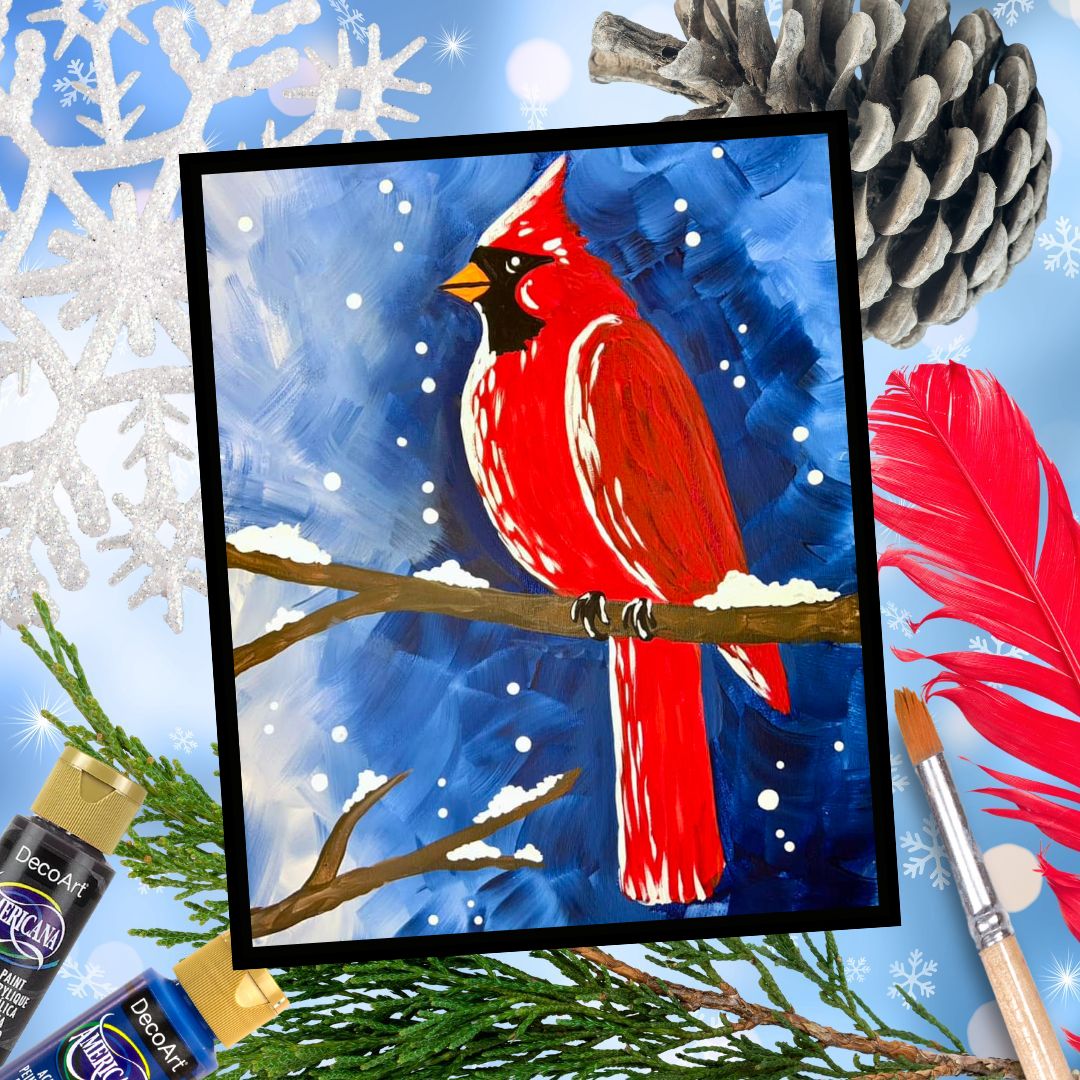 A completed painting of a red cardinal bird perched on a branch with a blue winter sky and snowflakes around, accompanied by art supplies and a pine branch in the background.