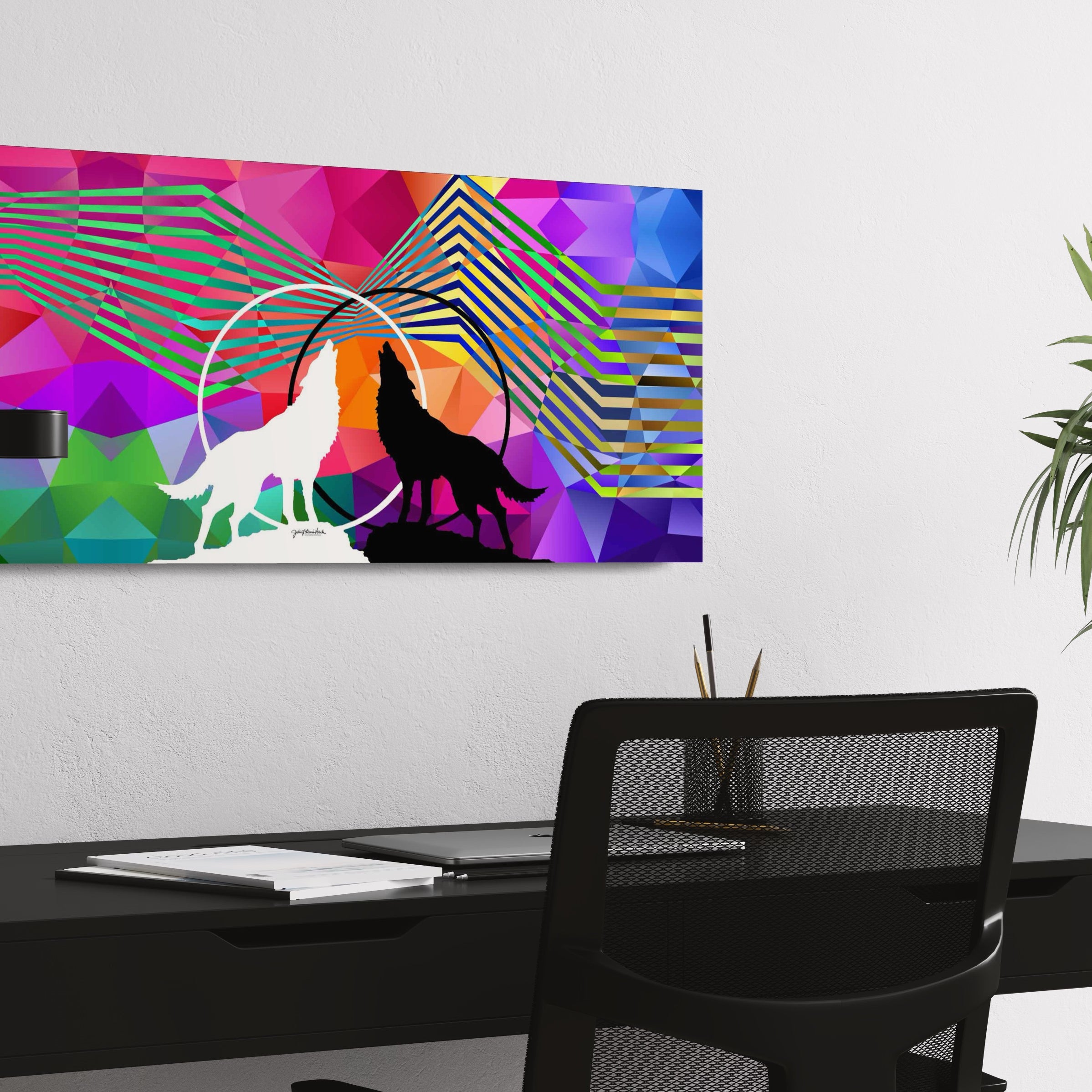 Side view of "Wolves Within" canvas print by Julie Davis hangs on wall above a sleek desk in a contemporary office.
