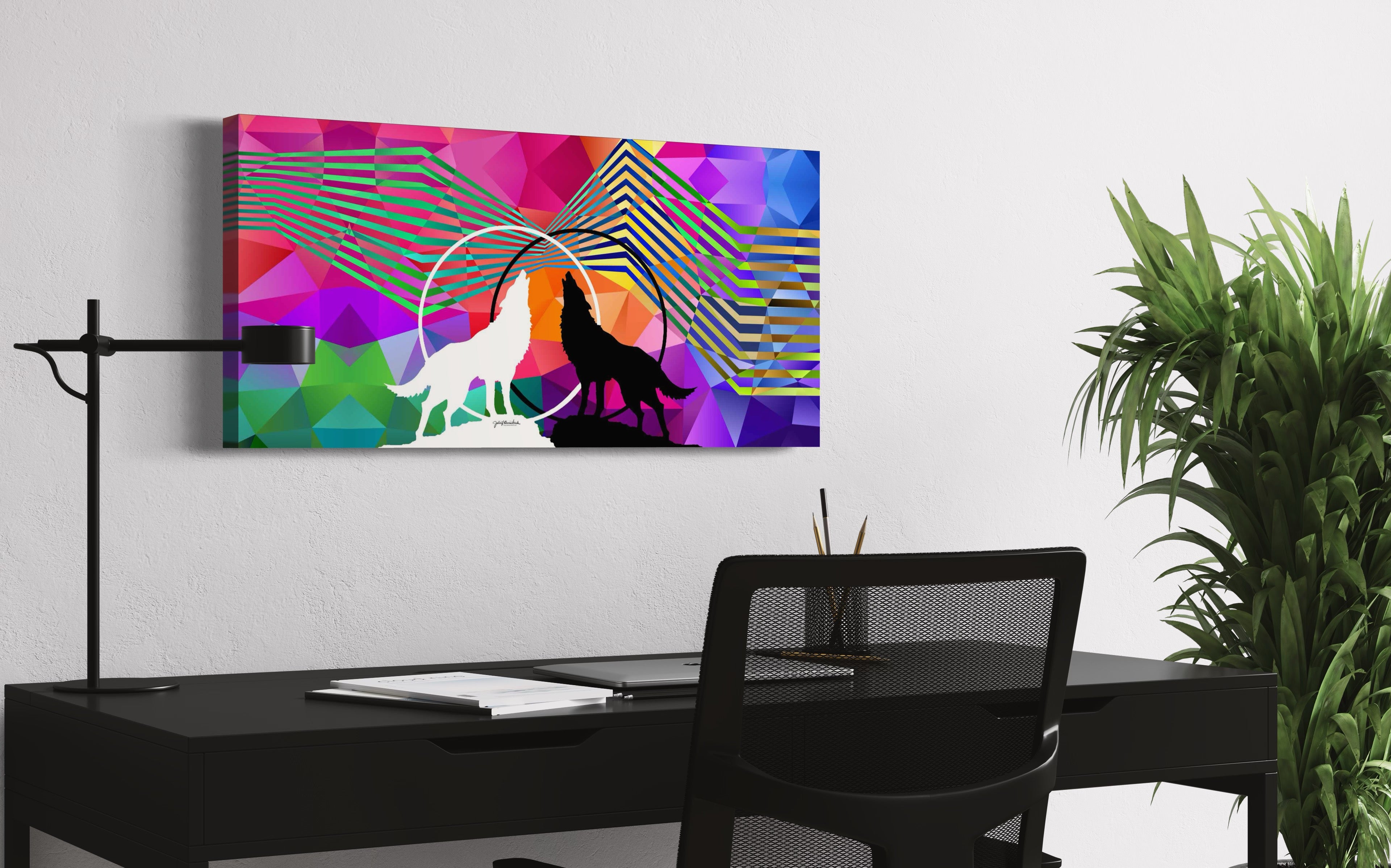 Side view of "Wolves Within" canvas print by Julie Davis hangs on wall above a sleek desk in a contemporary office.