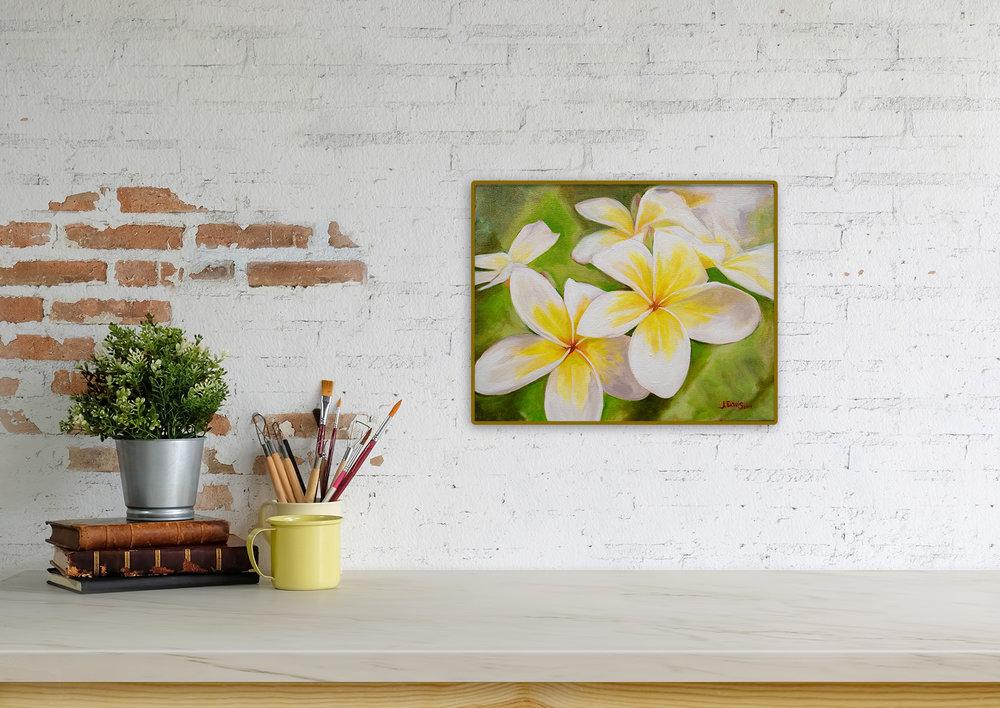 "Plumeria Morning" original painting by Julie Davis displayed on contemporay counter top
