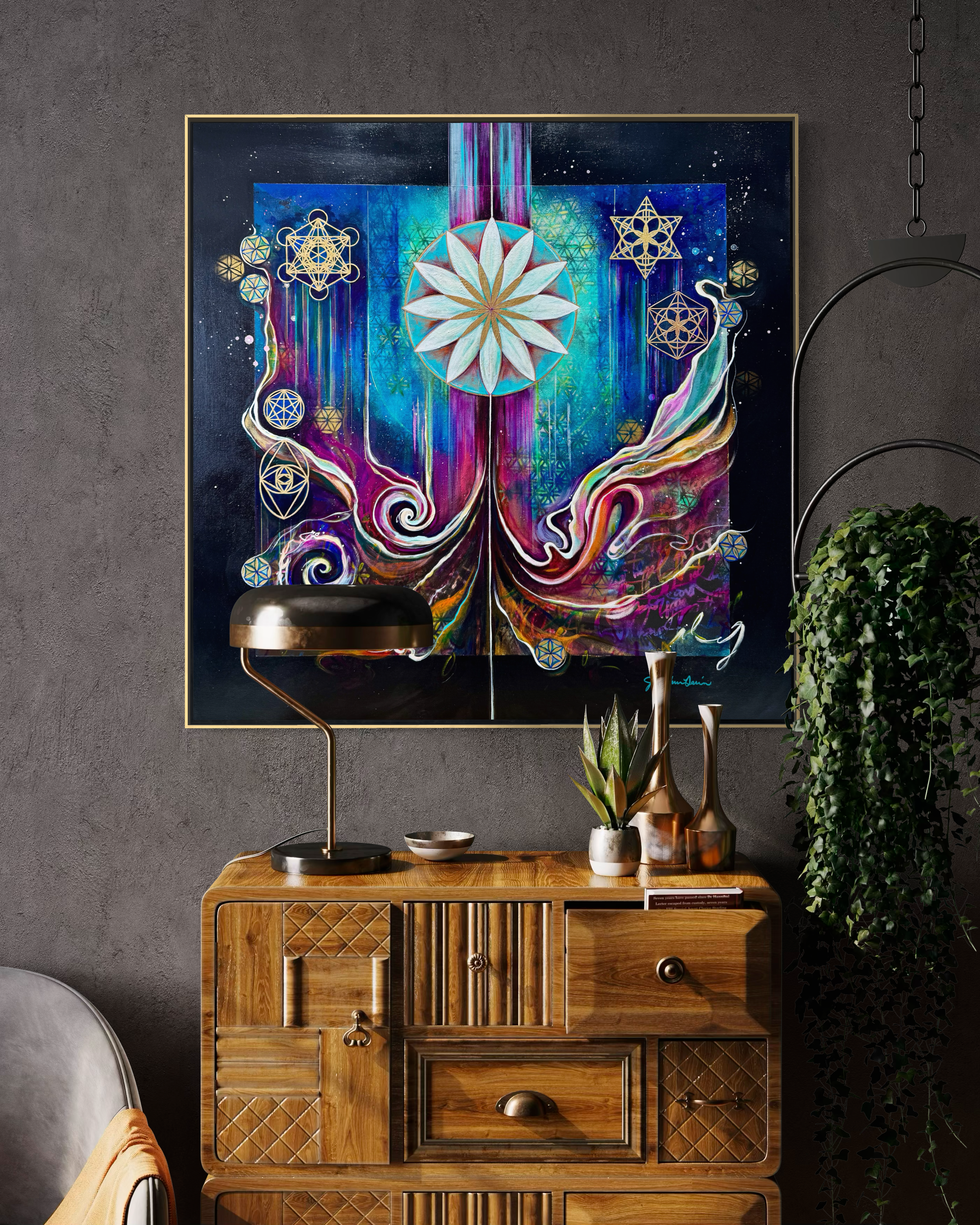 Colorful abstract painting, Culminating Consciousness, Sacred Geometry Art by Julie Davis on a gray wall above a wooden cabinet  in contemporary interior.