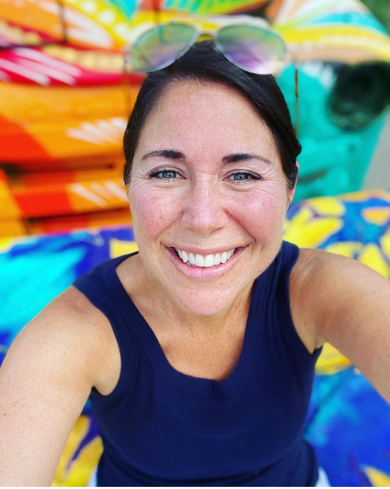 Fair-goer snaps a selfie on the Sunflower Sofa, painted by Julie Davis at the 2022 Indiana State Fair