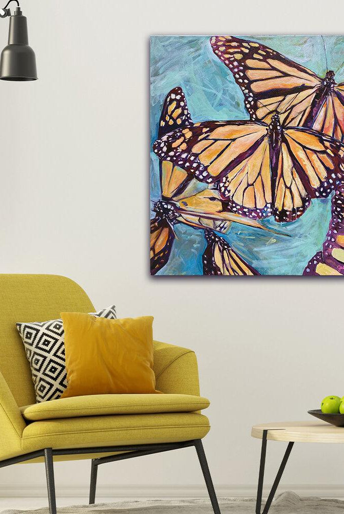 “Transformation Taking Flight” Original 36x36" on Large Canvas by Julie Davis Veach displayed in a bright colorful modern contemporary interior
