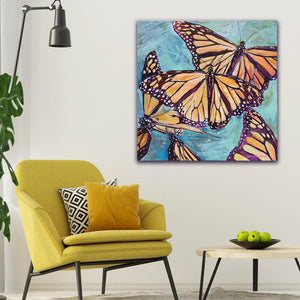 “Transformation Taking Flight” Original 36x36" on Large Canvas by Julie Davis Veach displayed in a bright colorful modern contemporary interior
